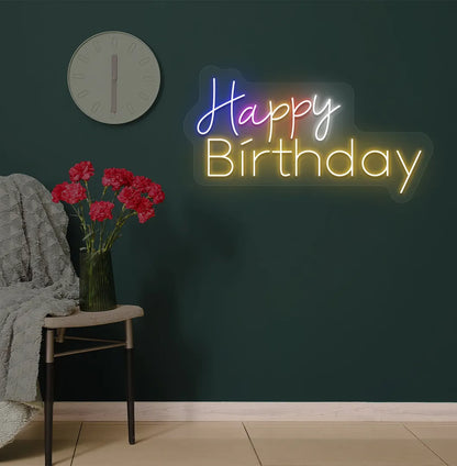 Trendy multicolor Happy Birthday neon sign mounted on party backdrop wall in orange color.