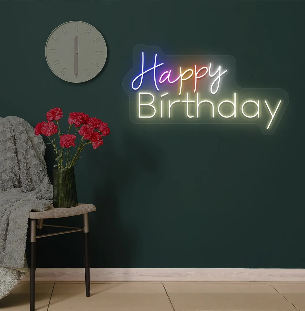 Trendy multicolor Happy Birthday neon sign mounted on party backdrop wall in warm white color.