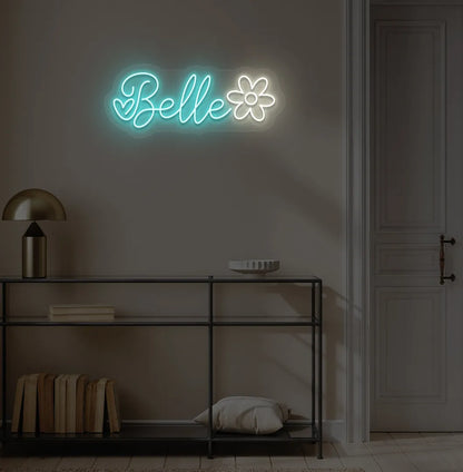 Personalized Name with Flower neon sign in ice blue color mounted on modern wall.