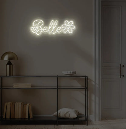 Stylish Name with Flower Custom neon sign mounted on aesthetic wall in warm white color.