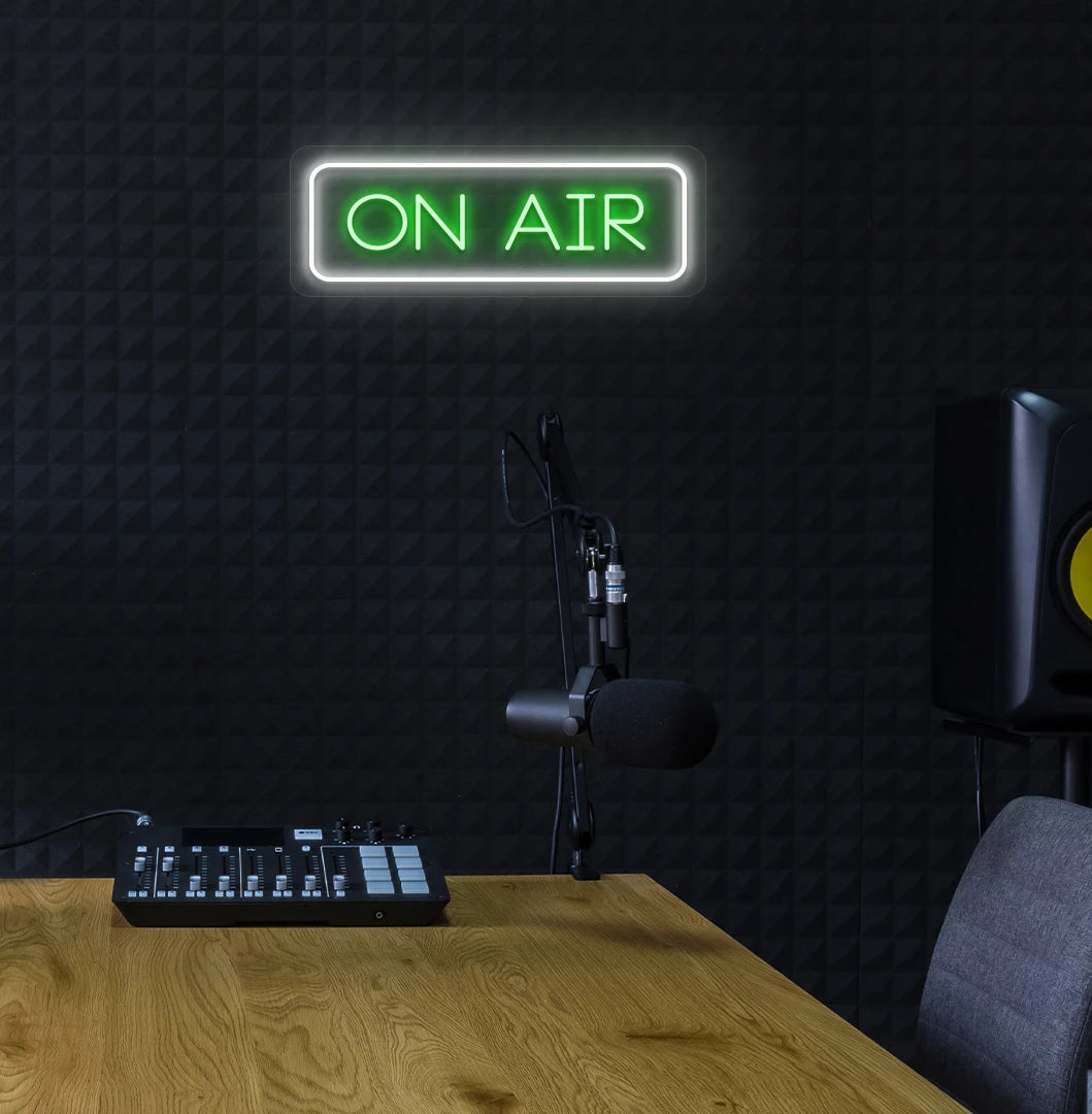 Professional ON Air neon sign in green mounted on wall.