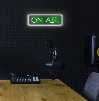 Professional ON Air neon sign in green mounted on wall.