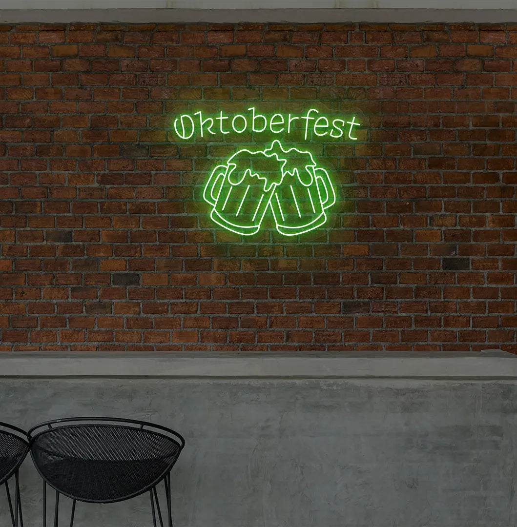 Oktoberfest with Beer Cup Neon Sign illuminated in green and mounted on a wall.
