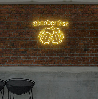 Oktoberfest with Beer Cup Neon Sign illuminated in orange and mounted on a wall