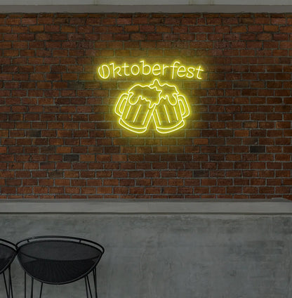 Oktoberfest with Beer Cup Neon Sign illuminated in yellow and mounted on a wall