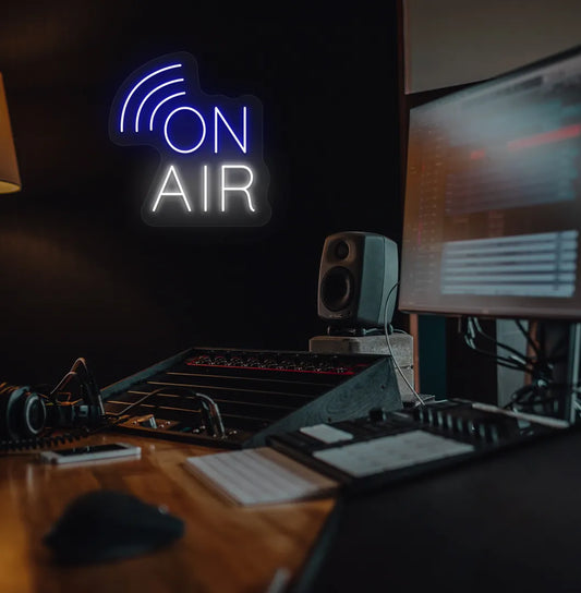 Image of an aesthetic studio room wall with "on air network" neon sign glowing blue.