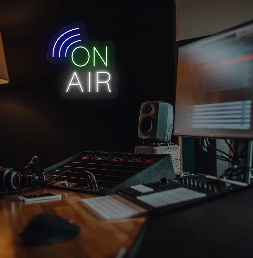 Stylish "on air network" neon sign in green mounted on studio room wall.