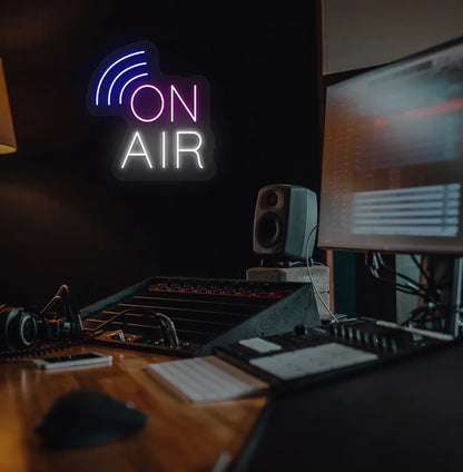 Stylish "on air network" neon sign in purple mounted on studio room wall.
