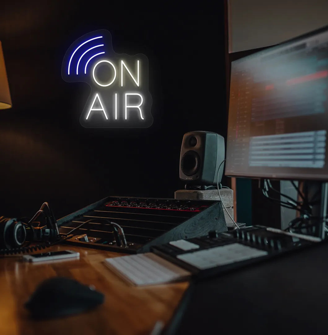 Stylish "on air network" neon sign in warm white mounted on studio room wall.