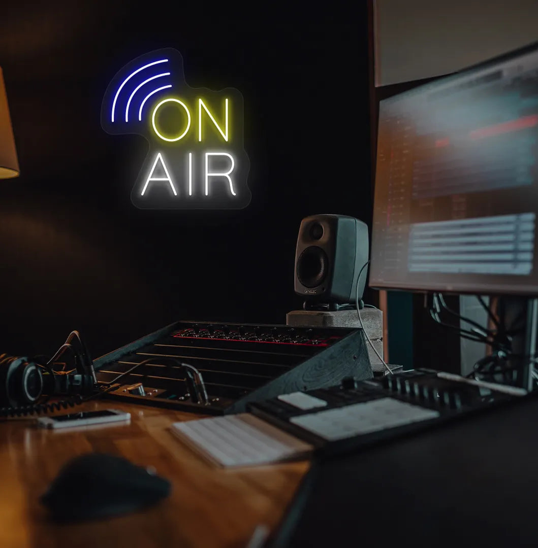Stylish "on air network" neon sign in yellow mounted on studio room wall.