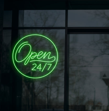 Business storefront with "open 24/7" LED neon sign glowing green.