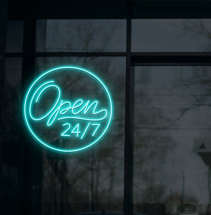 Image of a modern "open 24/7" LED neon sign glowing on wall in ice blue color.