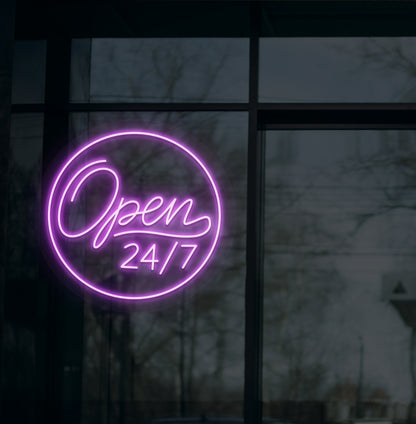 Business storefront with "open 24/7" LED neon sign glowing purple.