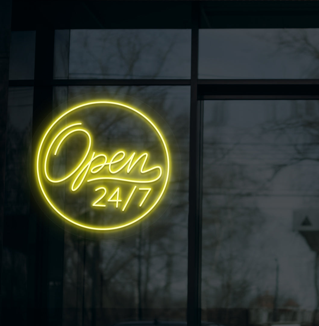 Business storefront with "open 24/7" LED neon sign glowing yellow.
