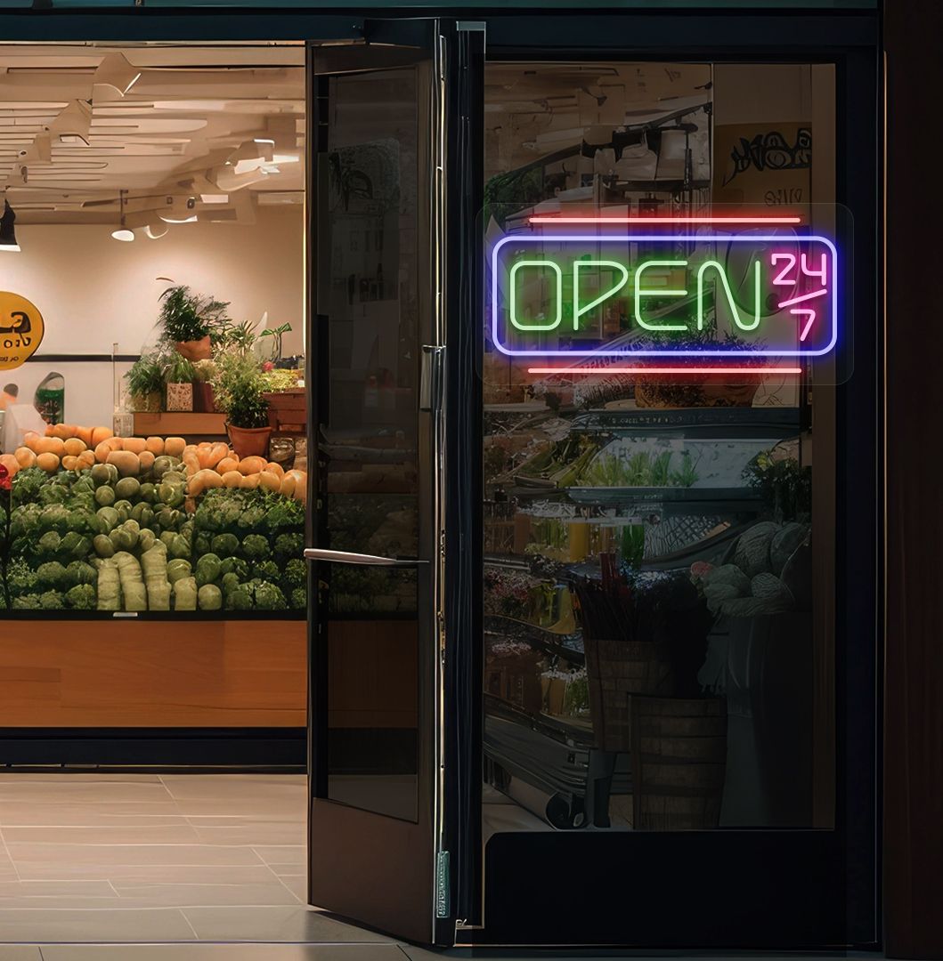 Modern open 24/7 neon sign glowing green on supermarket door.