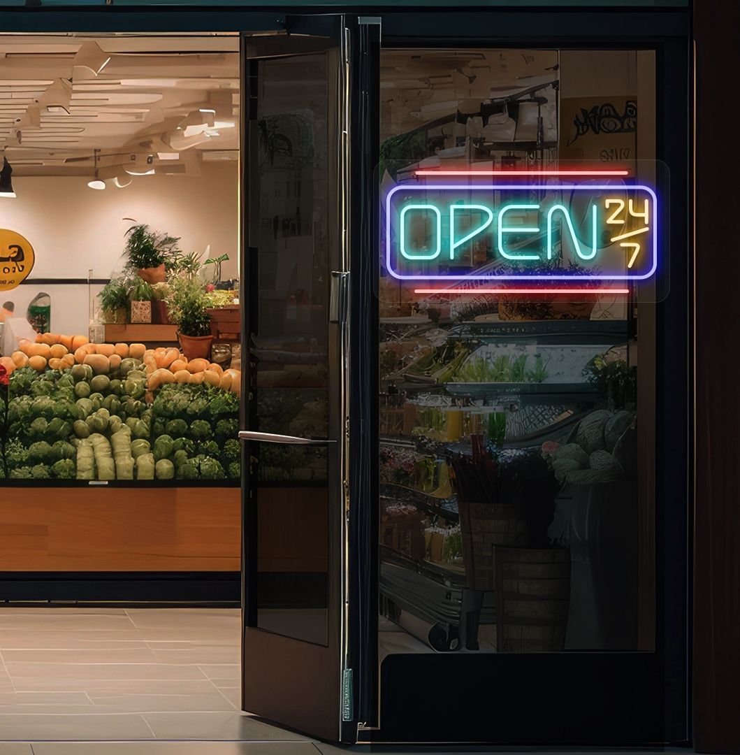 Image of an open 24/7 LED neon sign glowing on a store glass door in ice blue color.
