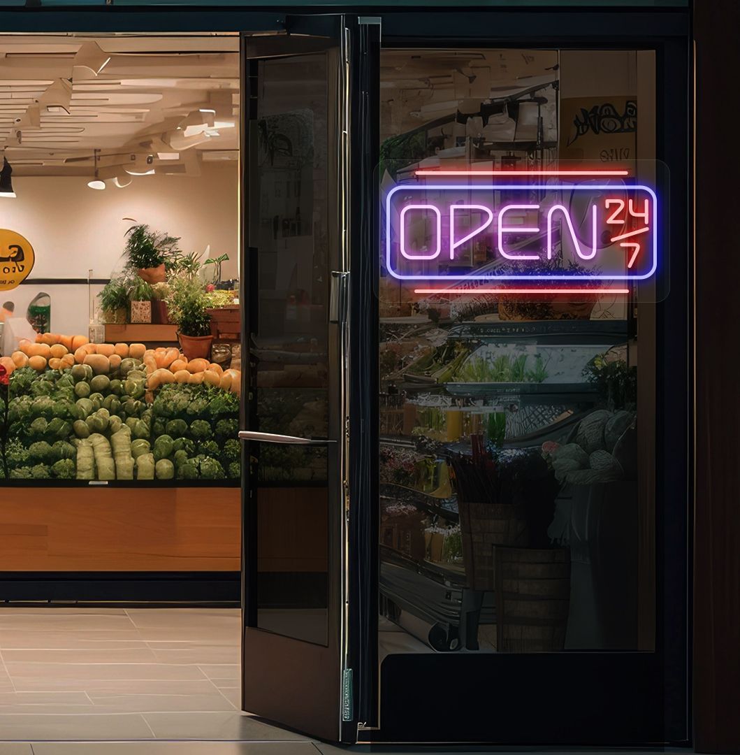 Modern open 24/7 neon sign glowing pink on supermarket door.