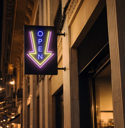 Image of an open arrow neon sign glowing on outdoor shop stand in blue color.