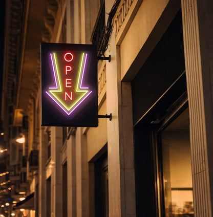 Image of an open arrow neon sign glowing on outdoor shop stand in red color.