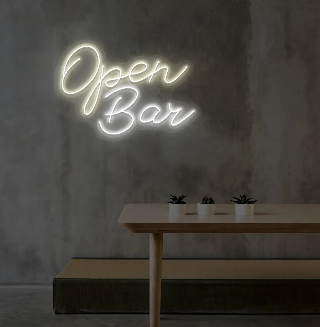 Stylish Open Bar LED neon sign mounted on aesthetic wall in warm white color.