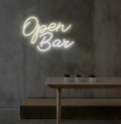 Stylish Open Bar LED neon sign mounted on aesthetic wall in warm white color.