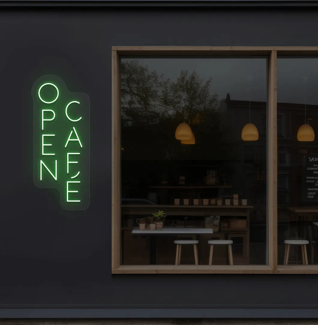 Trendy open cafe neon sign in green mounted on coffee shop wall.