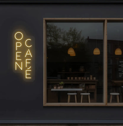 Trendy open cafe neon sign in orange mounted on coffee shop wall.