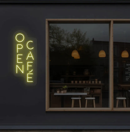 Trendy open cafe neon sign in yellow mounted on coffee shop wall.