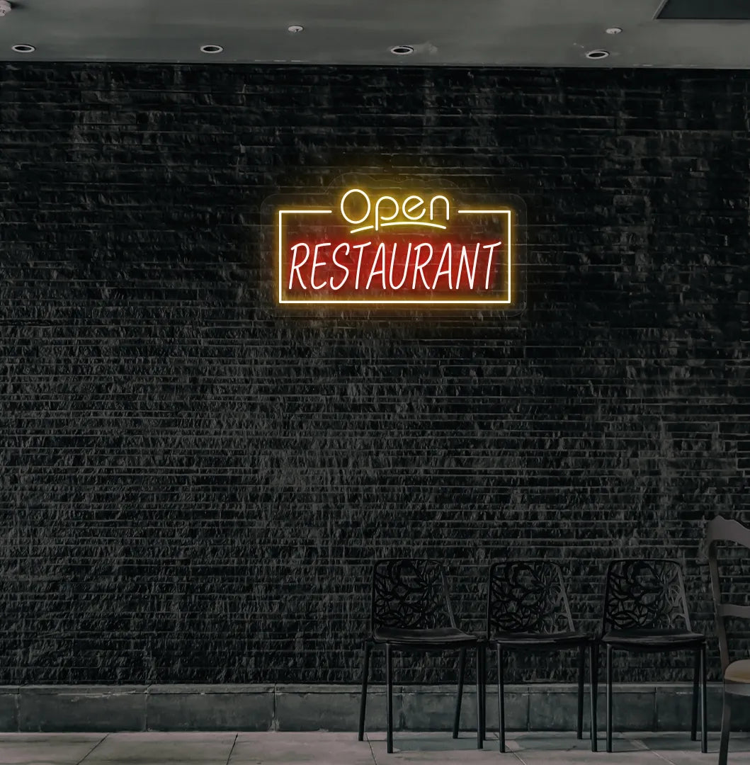 Stylish open restaurant neon sign in orange mounted on restaurant wall.