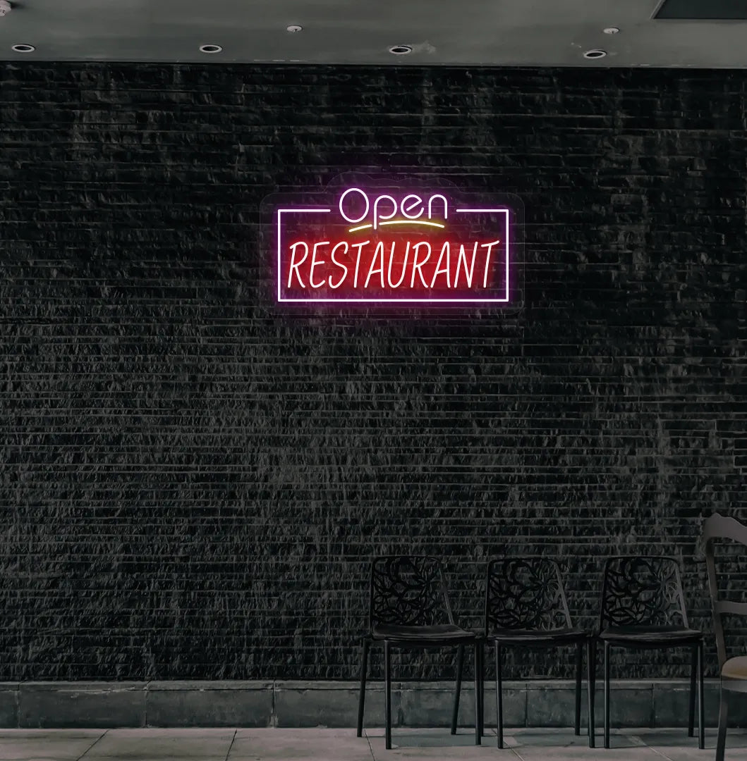 Stylish open restaurant neon sign in purple mounted on restaurant wall.