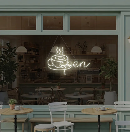 Modern cafe wall with open with coffee cup neon sign glowing warm white.