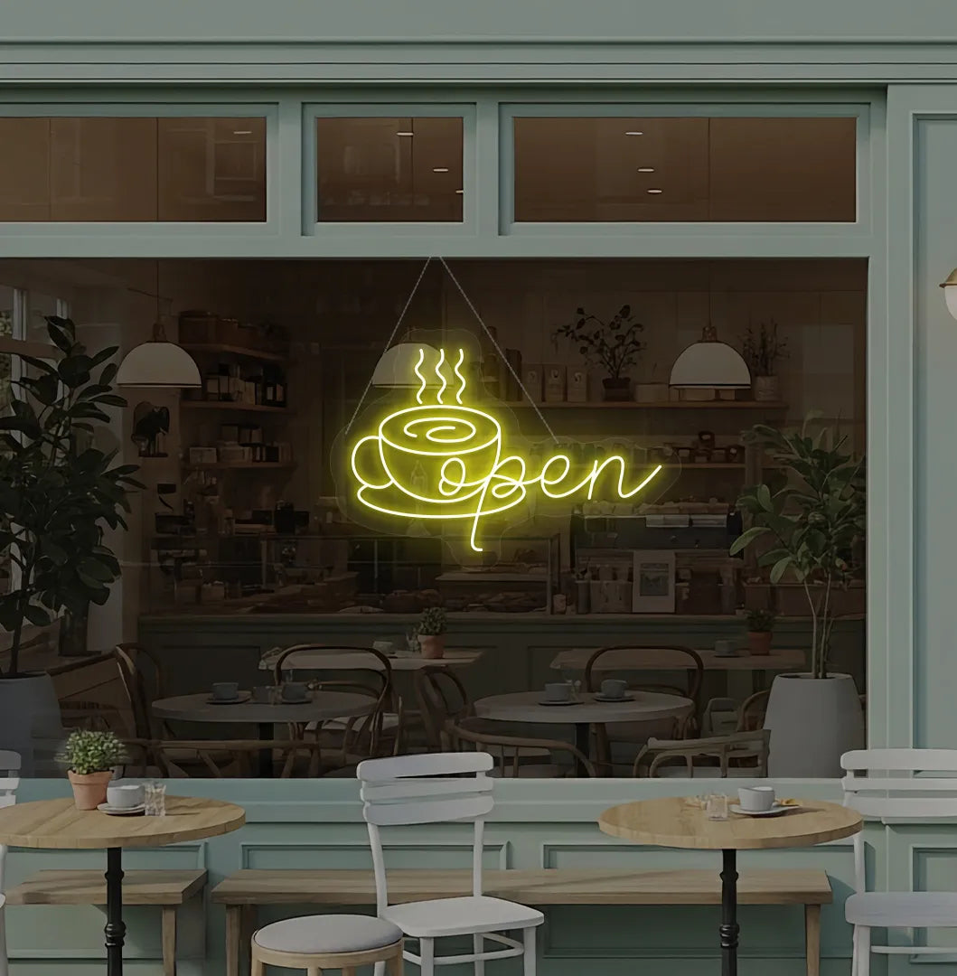 Modern cafe wall with open with coffee cup neon sign glowing yellow.