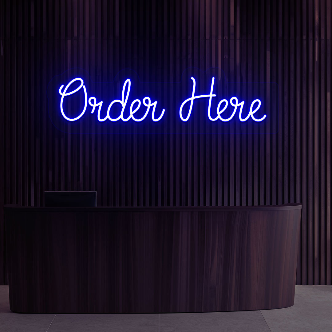 A bright blue "order now" neon sign is hanging on the cafe's wooden wall. Perfect for cafés, restaurants, food counters, and retail service counters.