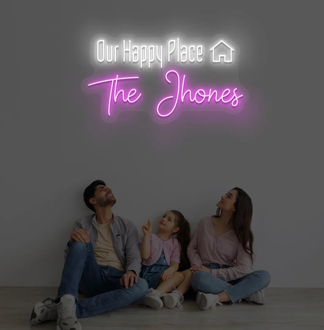 Personalized Our Happy Place custom name neon sign in pink color mounted on modern wall.