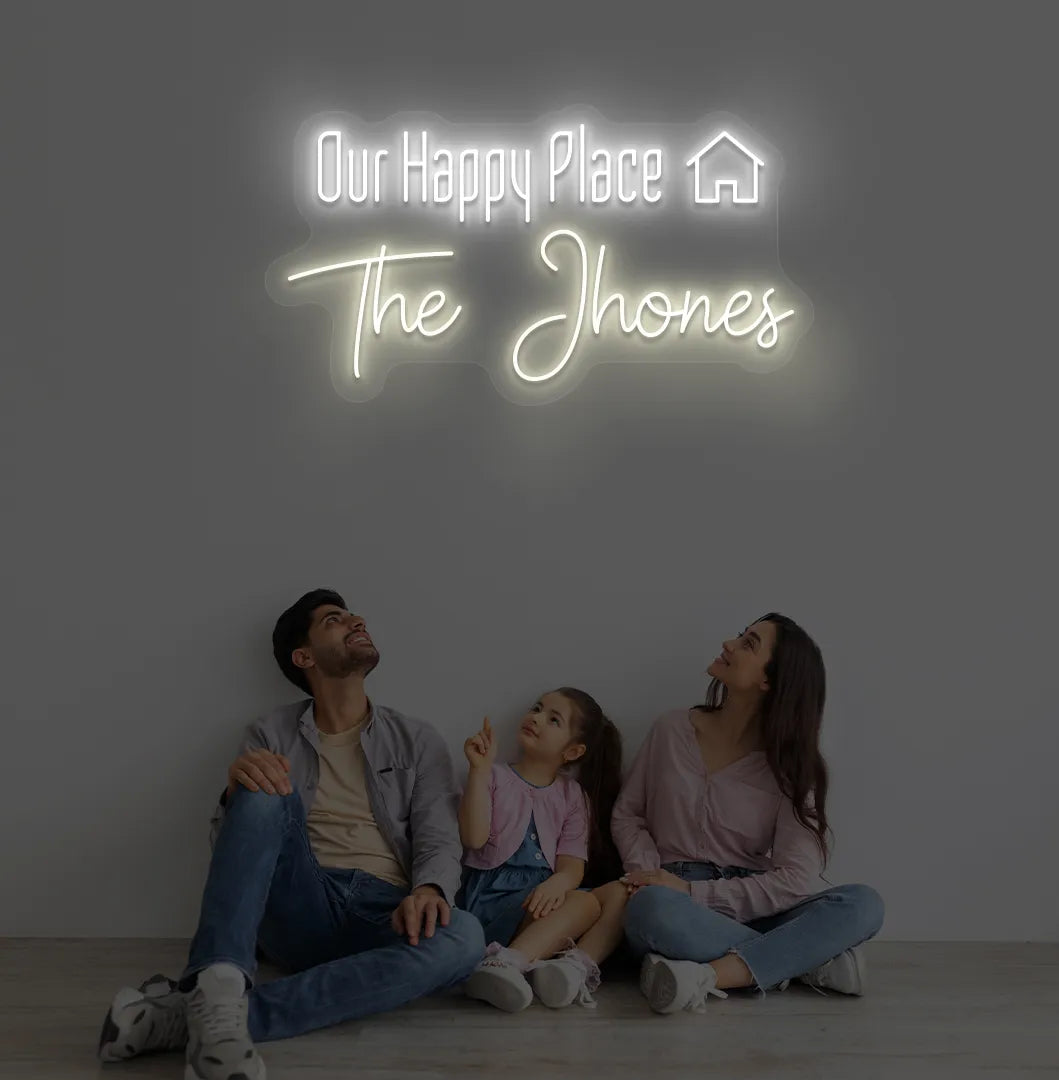 Bright warm white Our Happy Place personalized name neon sign for home decoration.