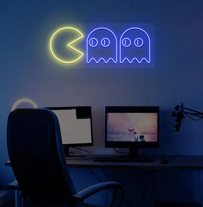 Image of a retro arcade Pacman neon sign mounted on gamer room wall in blue color.