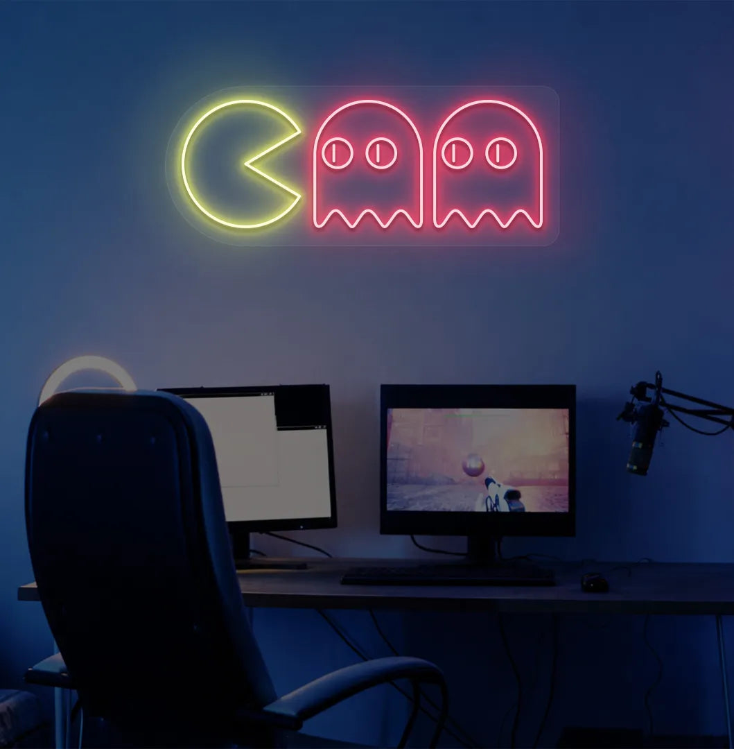 Image of a retro arcade Pacman neon sign mounted on gamer room wall in red color.