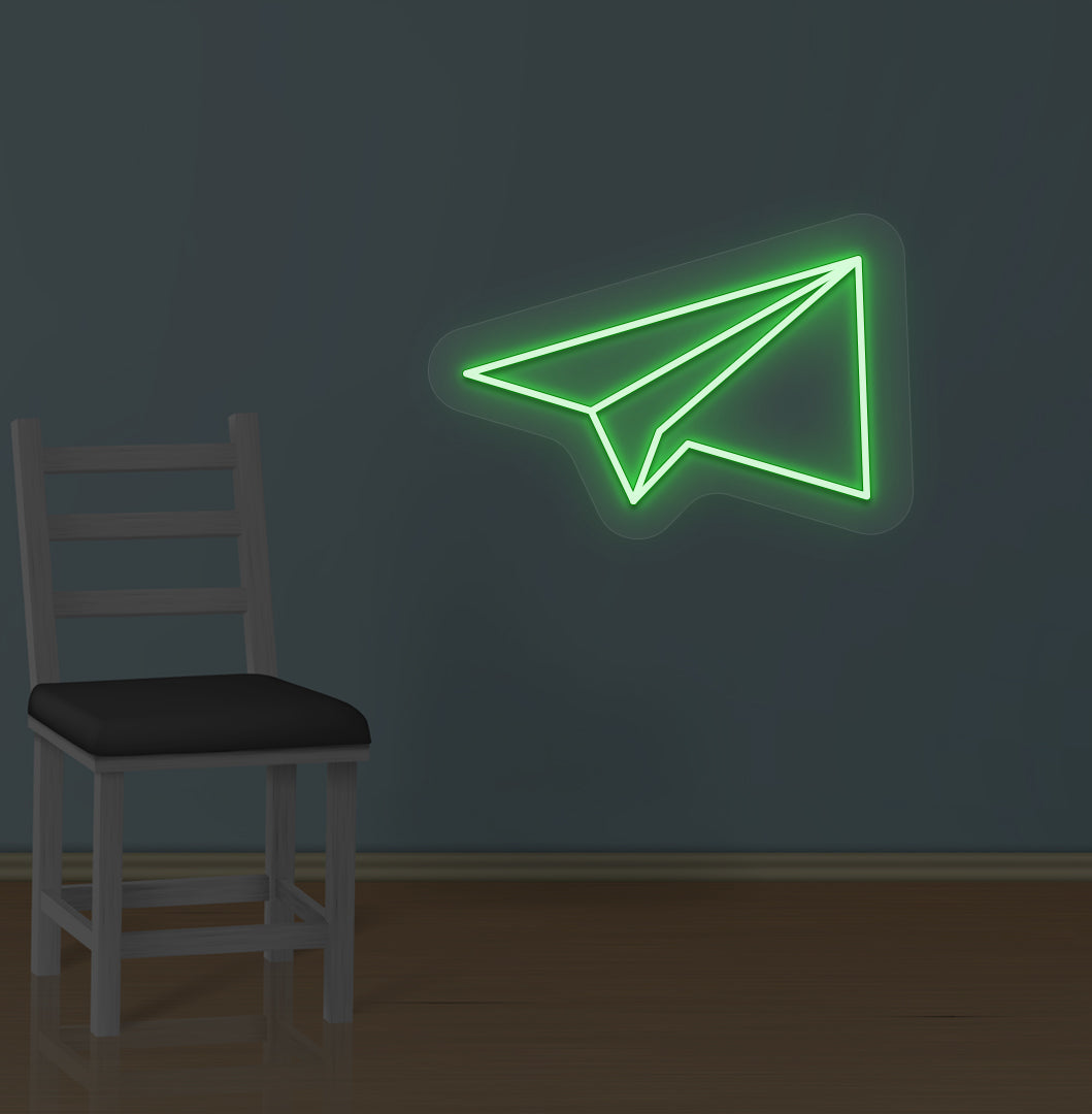 Modern wall with paper plane LED neon sign glowing green.