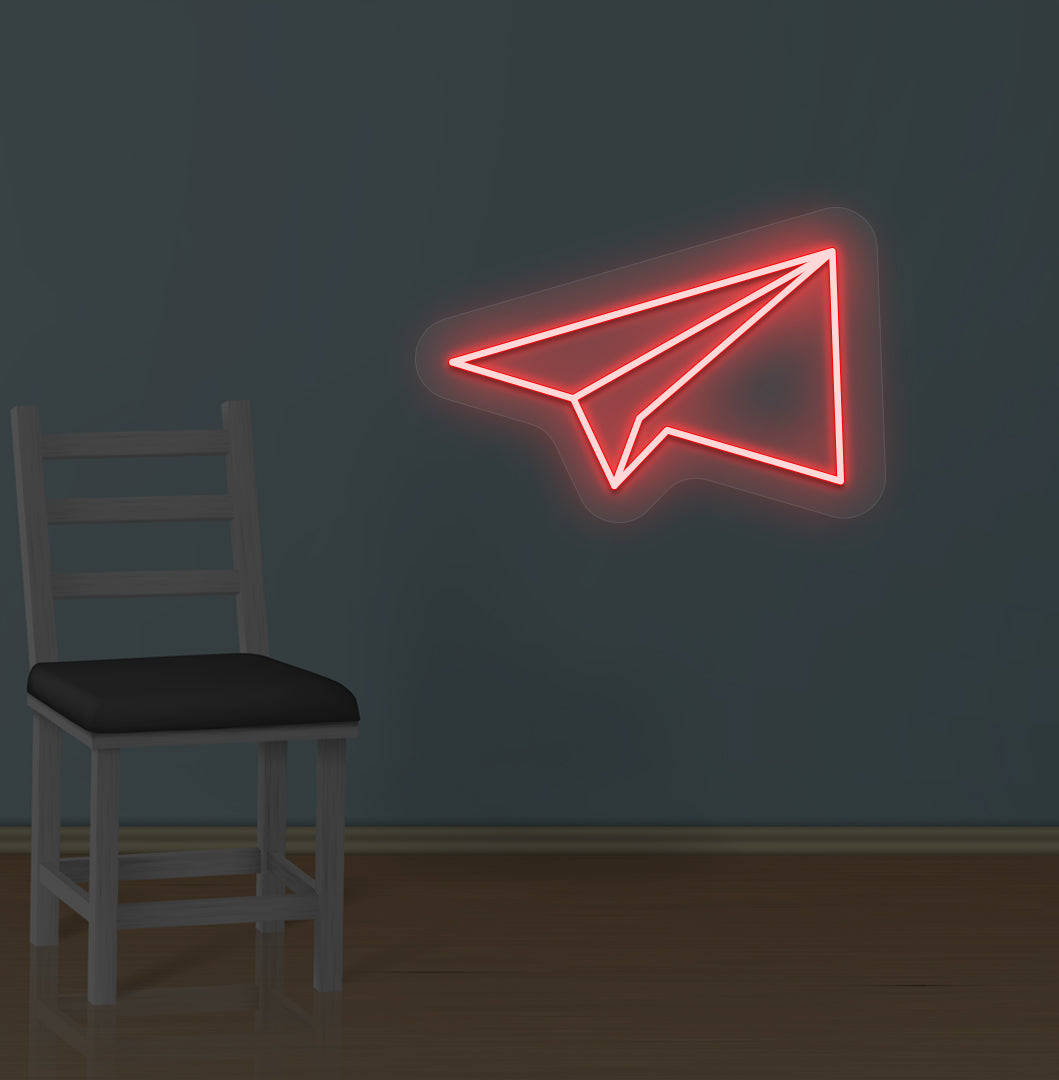 Image of a paper plane LED neon sign glowing on a wall in red color.