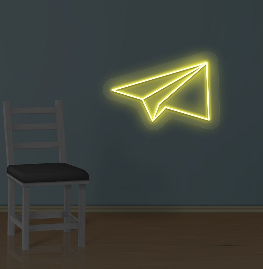 Modern wall with paper plane LED neon sign glowing yellow.