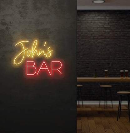 Stylish Personalized Bar Name neon sign mounted on aesthetic wall in orange color.