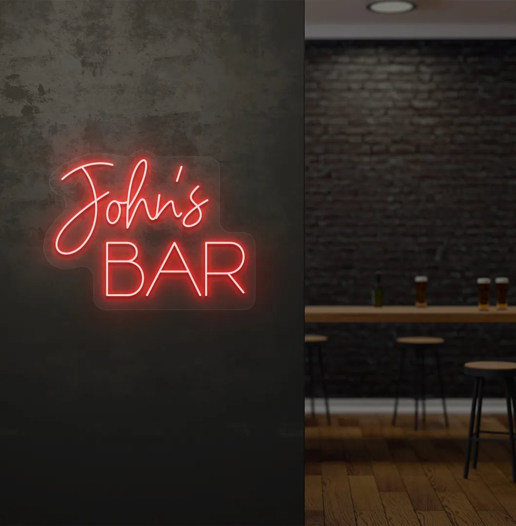 Personalized Bar Name neon sign mounted on decorative wall in red color.