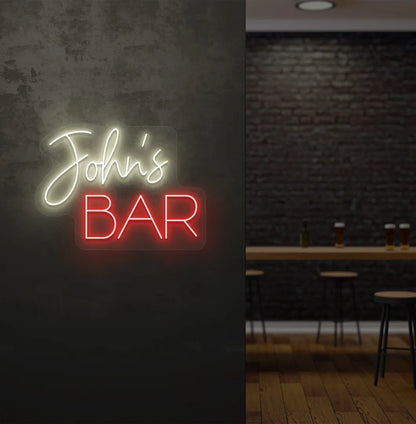 Stylish Personalized Bar Name neon sign mounted on aesthetic wall in warm white color.