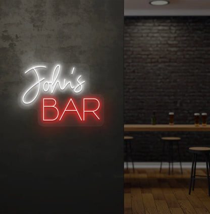 Personalized Bar Name neon sign mounted on decorative wall in white color.