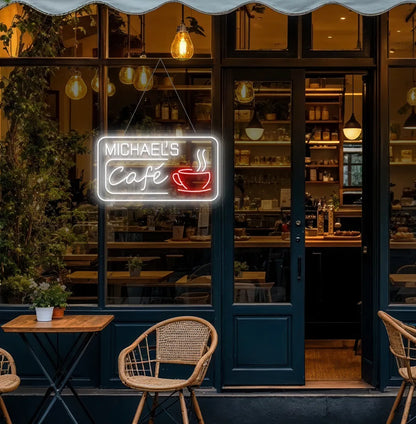 Image of a personalized coffee shop neon sign hanging on a cafe door in white color.