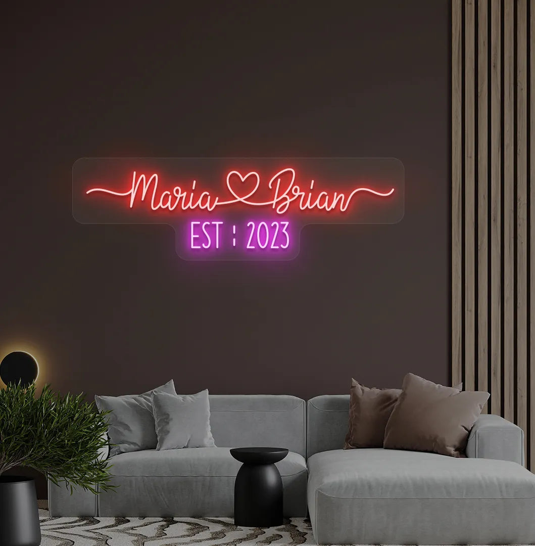 Romantic custom Couple Name EST neon sign glowing red on aesthetic wall.