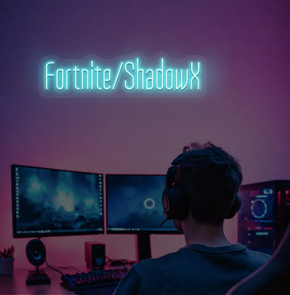 Ice Blue LED Personalized Game and Name neon sign glowing on gaming room wall.
