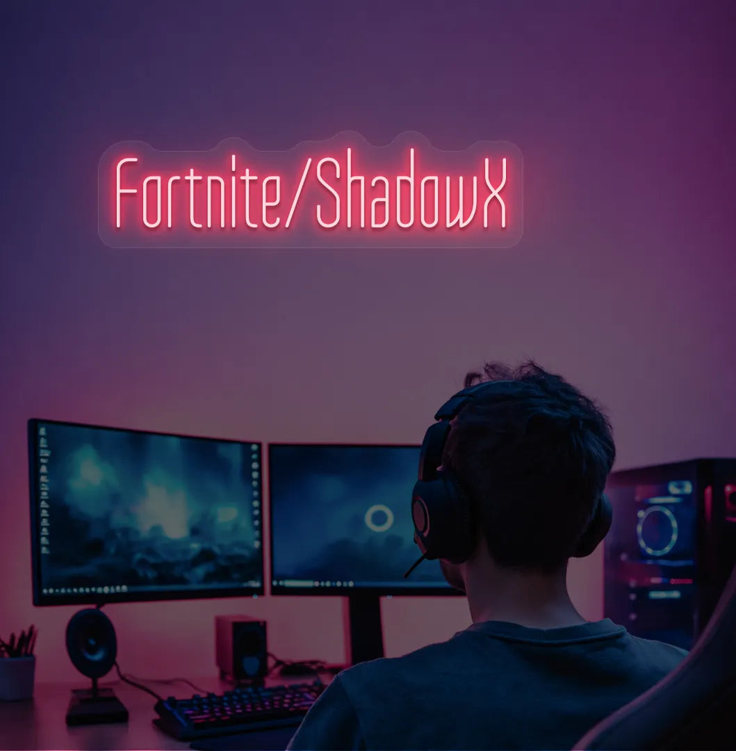 Red LED Personalized Game and Name neon sign glowing on gaming room wall.