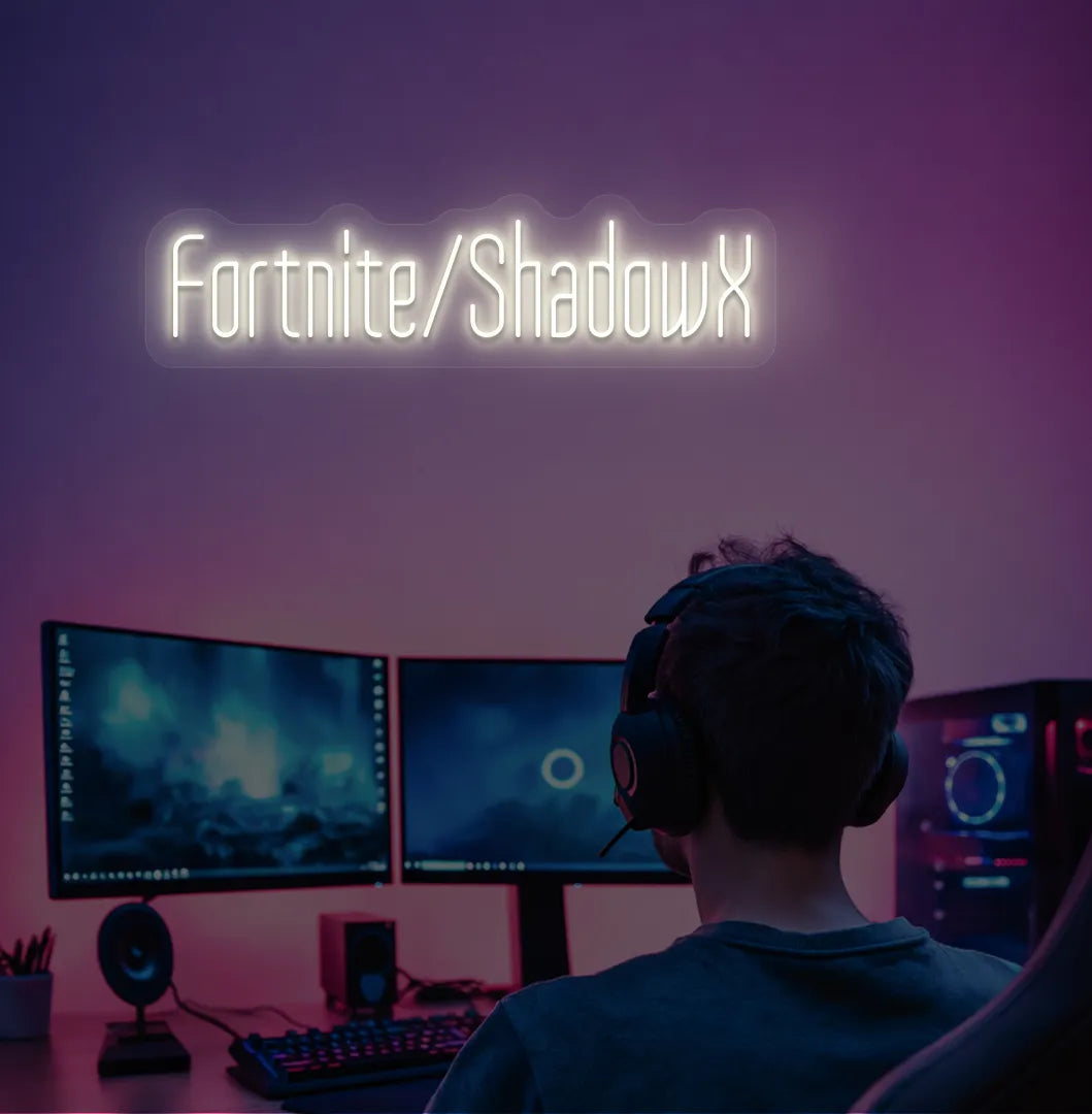 Modern gaming setup featuring Personalized Game and Name blue neon sign in warm white color.