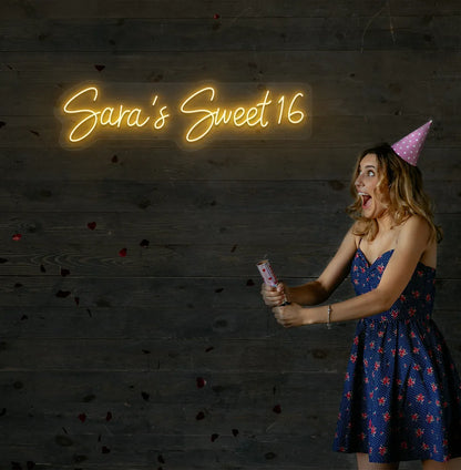 Custom Sweet 16 birthday neon sign mounted on modern event wall in orange color.